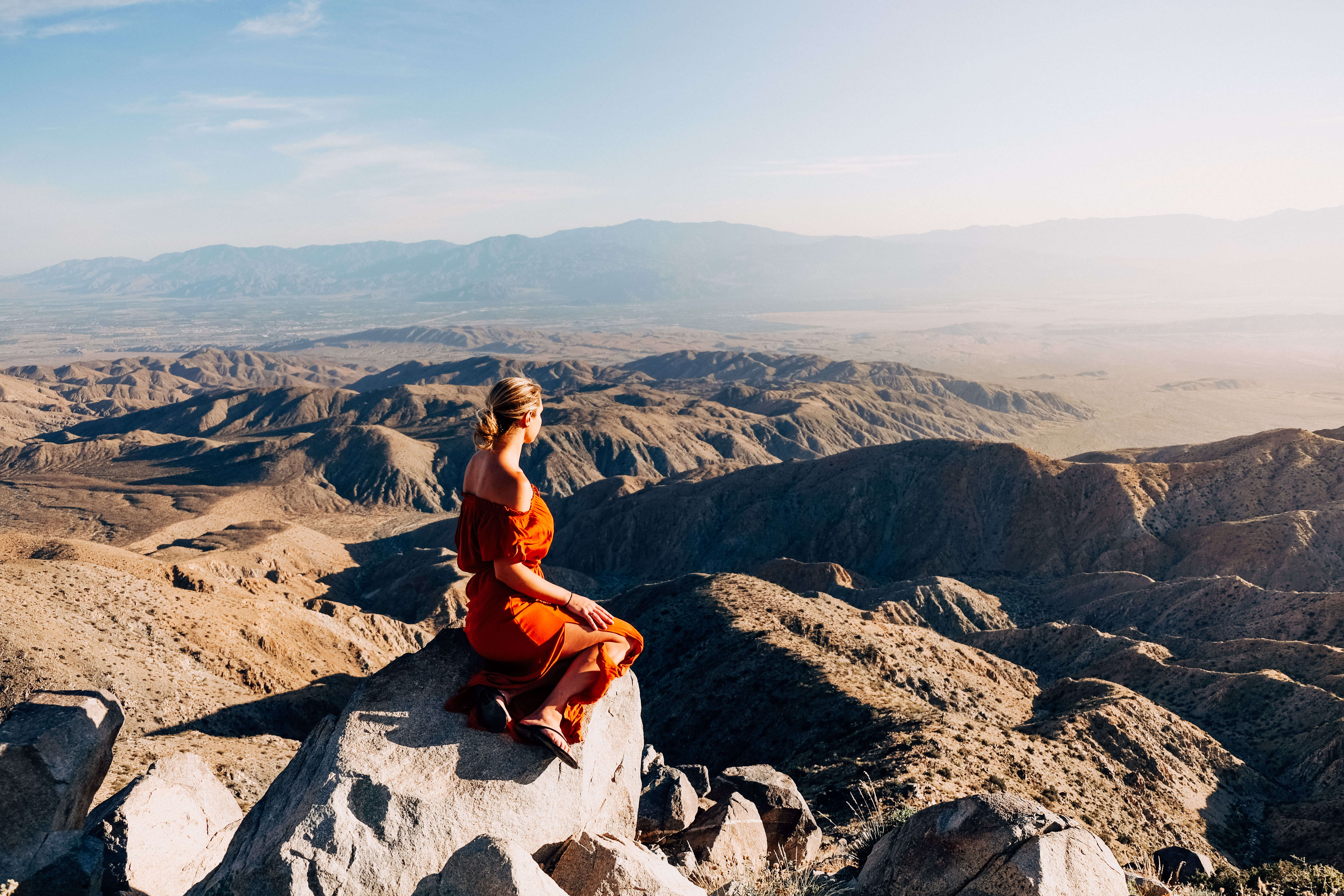 Woman sitting on viewpoint