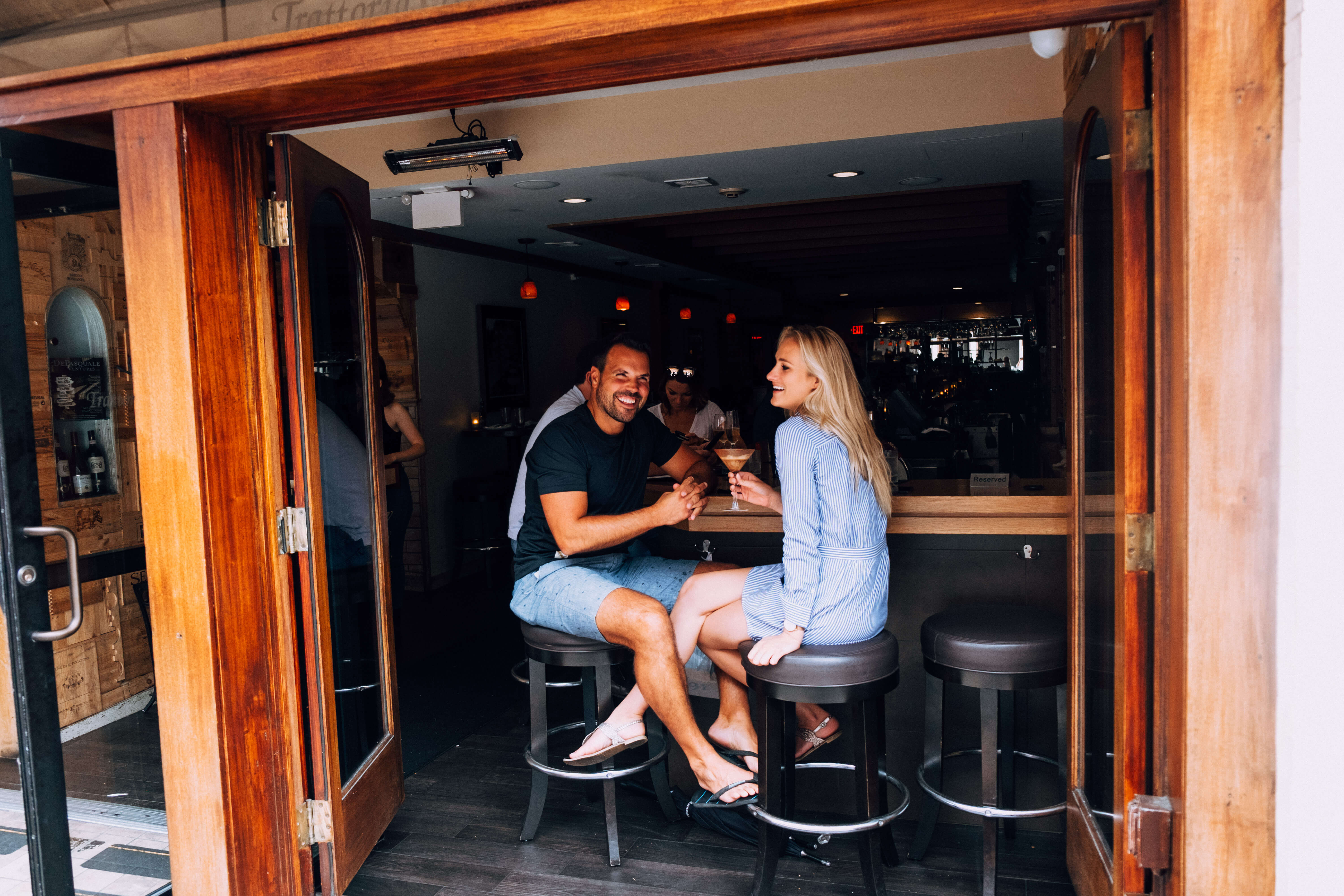 Couple sitting at bar in Boston