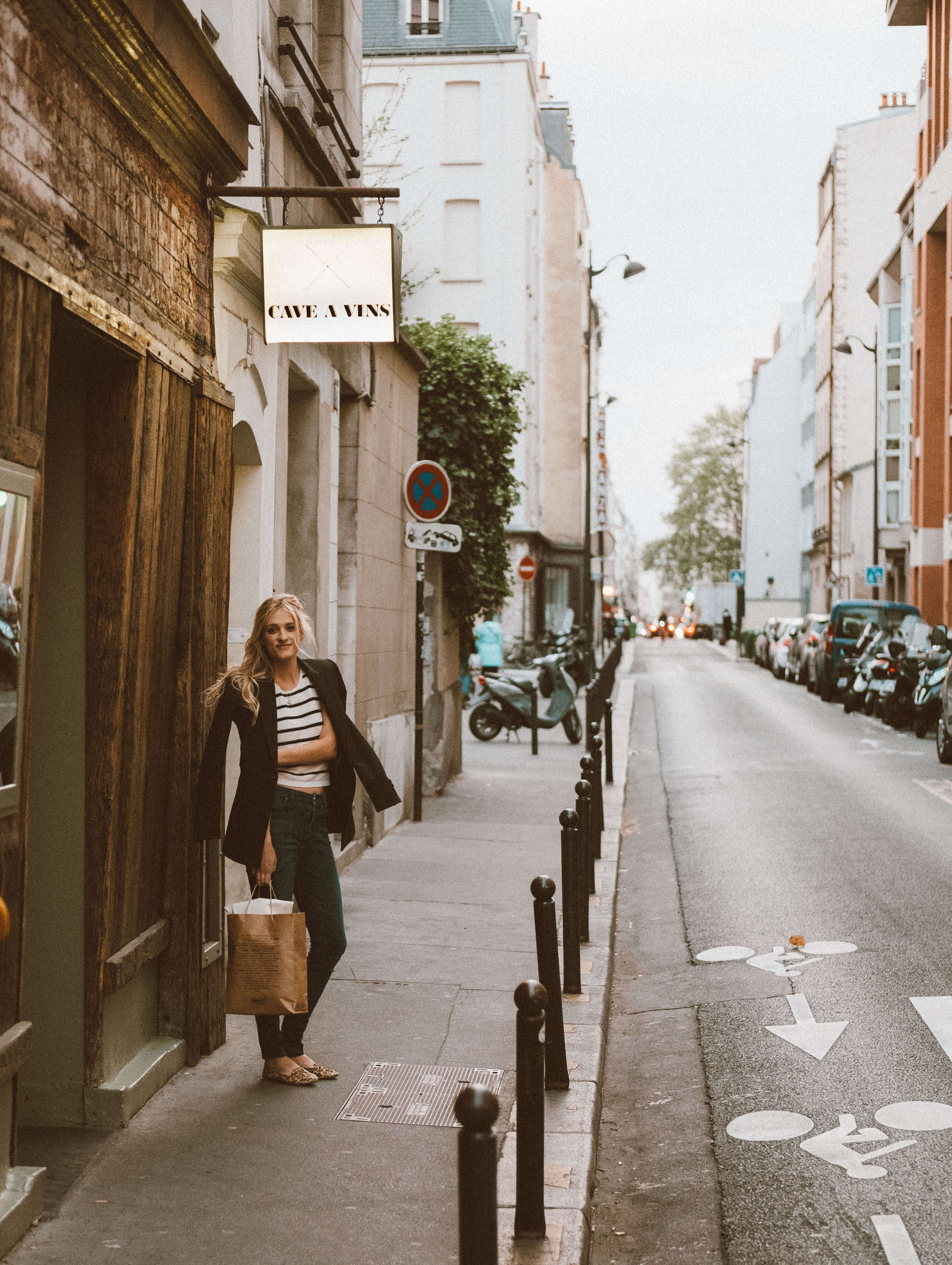 Girl outside Cave Vin Septime Wine Bar Paris