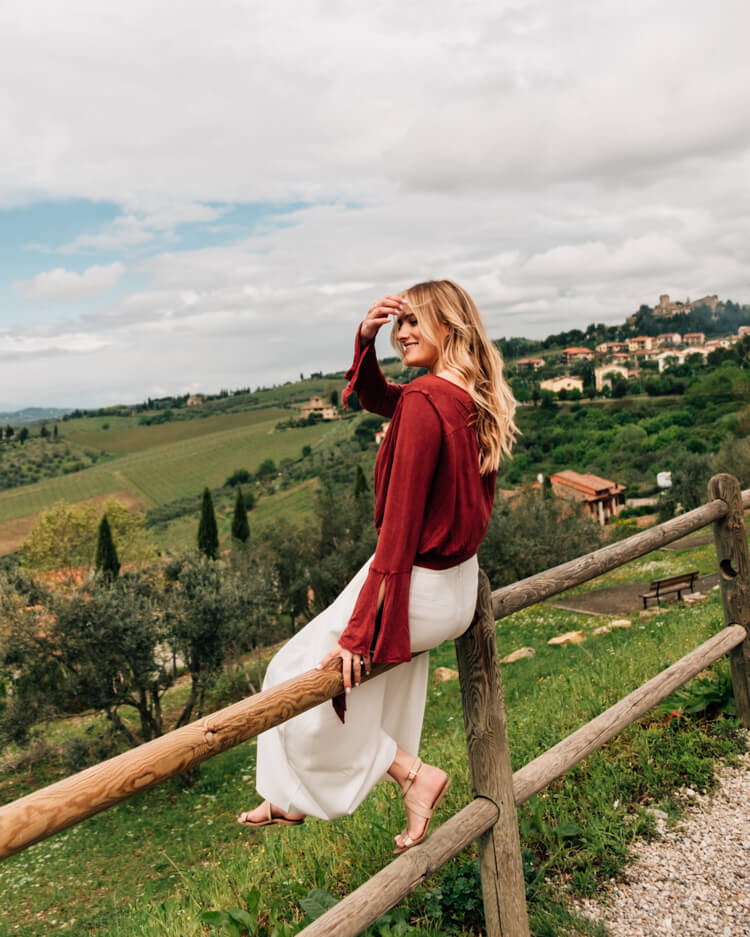 Girl sitting overlooking Tuscany